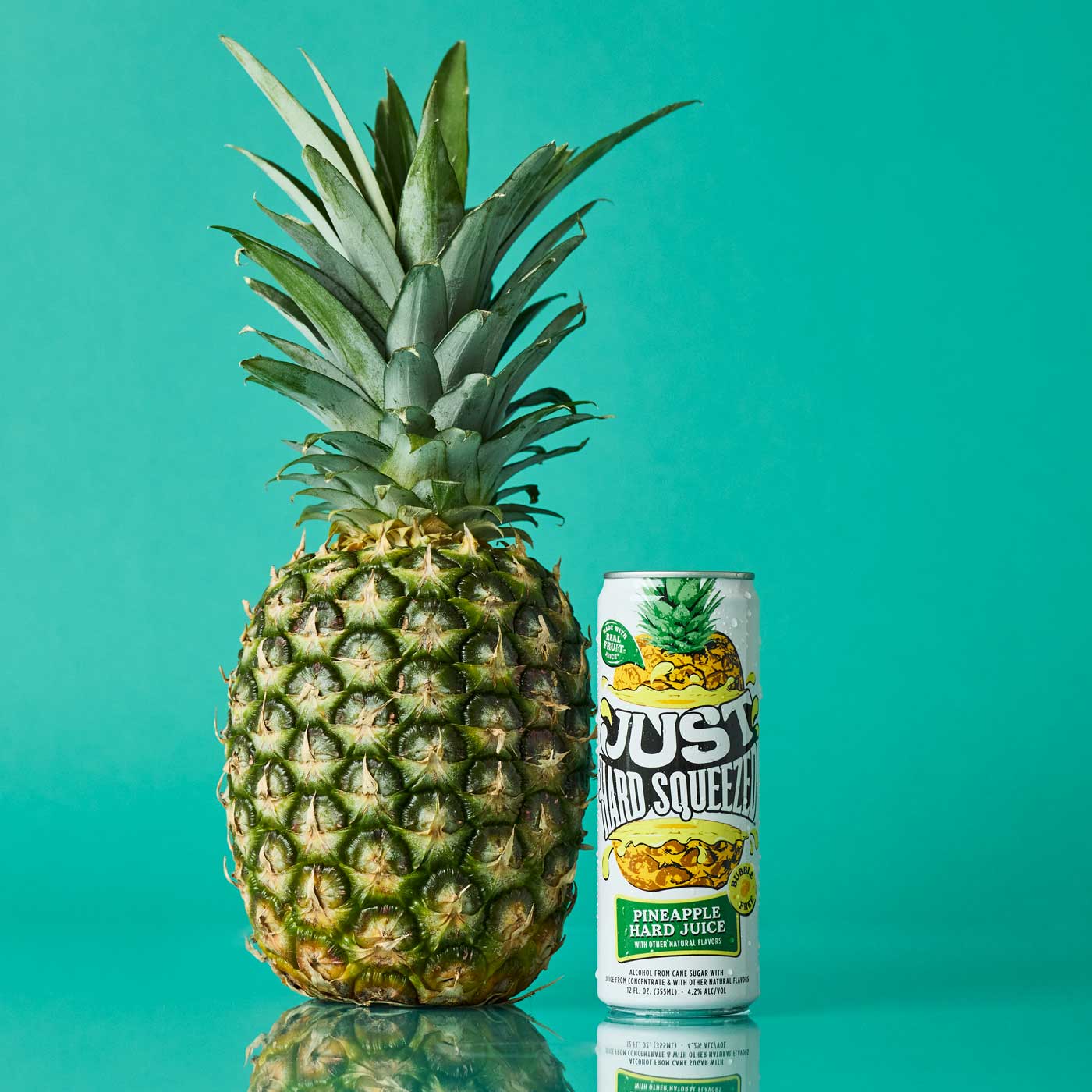 a can of just hard squeezed pineapple next to a pineapple