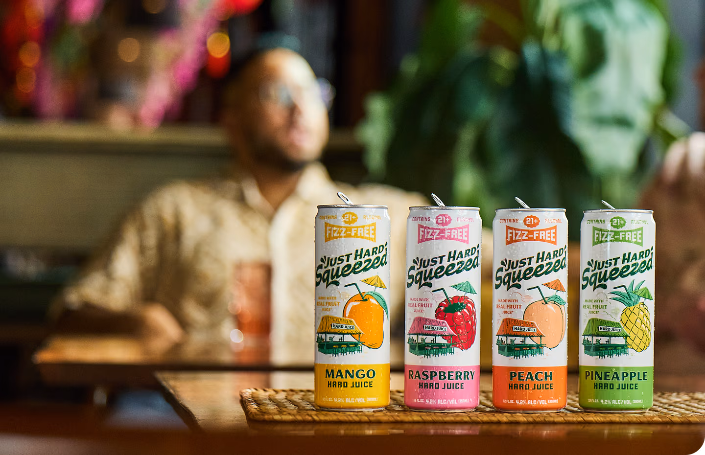 A row of Just Hard Squeezed cans